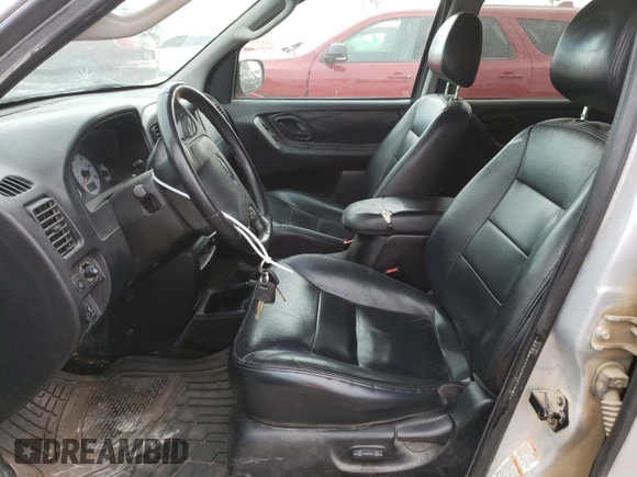2004 Ford Escape Limited with VIN 1FMCU94184KB62778, listed as a Copart auction lot 70992184 with 165,199 mi miles and Salvage Title. Bid and sale history available at carsss.com. Image 7.