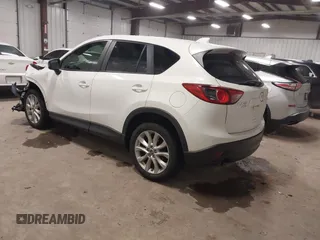 2014 Mazda CX-5 Grand Touring with VIN JM3KE4DY3E0374036, listed as a IAAI auction lot 41889030 with 162,611 mi miles and . Bid and sale history available at DreamBid. Image 3.