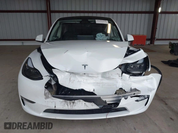 2023 Tesla Model Y Long Range z VIN 7SAYGDEE2PF834036, wystawiony jako IAAI lot #41933120 z przebiegiem 27 872 mil mil oraz . Historia ofert i sprzedaży dostępna na DreamBid. Obrazek 13.