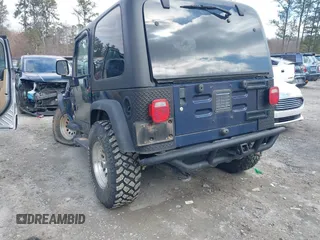 2006 Jeep Wrangler Sport with VIN 1J4FA49S66P732419, listed as a IAAI auction lot 41607851 with 120,099 mi miles. Bid and sale history available at carsss.com. Image 3.