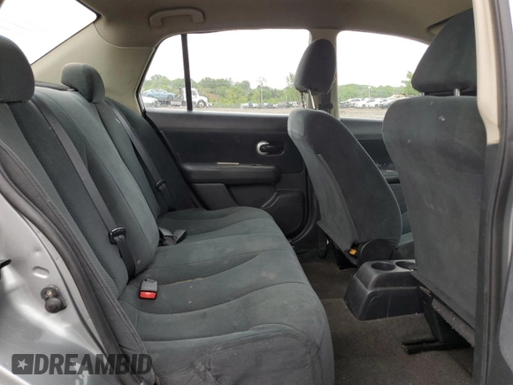 2010 Nissan Versa S z VIN 3N1BC1AP9AL418100, wystawiony jako Copart lot #57971985 z przebiegiem 95 353 mil mil oraz Szkoda całkowita • Salvage title. Historia ofert i sprzedaży dostępna na DreamBid. Obrazek 10.