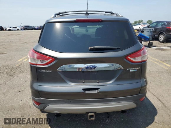 2015 Ford Escape Titanium z VIN 1FMCU9J97FUA38731, wystawiony jako Copart lot #60621085 z przebiegiem 119 704 mil mil oraz Szkoda całkowita • Salvage title. Historia ofert i sprzedaży dostępna na DreamBid. Obrazek 6.