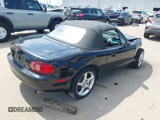 2002 Mazda MX-5 Miata Cloth with VIN JM1NB353520221312, listed as a IAAI auction lot 42410028 with 99,375 mi miles and . Bid and sale history available at DreamBid. Image 4.