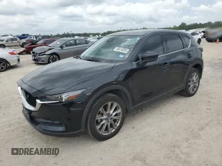 2021 Mazda CX-5 Grand Touring with VIN JM3KFBDM0M1398172, listed as a Copart auction lot 54514265 with 24,443 mi miles and Salvage Title. Bid and sale history available at DreamBid. Image 1.