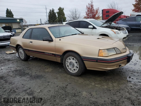 1987 Ford Thunderbird with VIN 1FABP64W7HH137025, listed as a Copart auction lot 80162264 with 137,140 mi miles and Salvage Title. Bid and sale history available at DreamBid. Image 4.