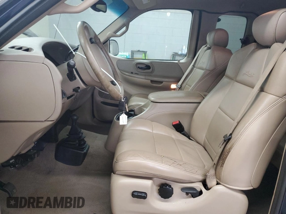 2002 Ford F-150 XL with VIN 1FTRX18L62NA69837, listed as a Copart auction lot 61581935 with 130,078 mi miles and Salvage title. Bid and sale history available at DreamBid. Image 7.