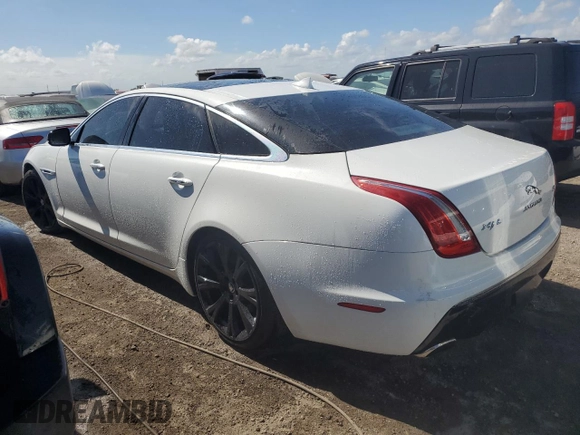 2014 Jaguar XJ Portfolio z VIN SAJWA2GZ0E8V59422, wystawiony jako Copart lot #74213414 z przebiegiem 96 314 mil mil oraz Nie do naprawy • Non repairable. Historia ofert i sprzedaży dostępna na DreamBid. Obrazek 2.