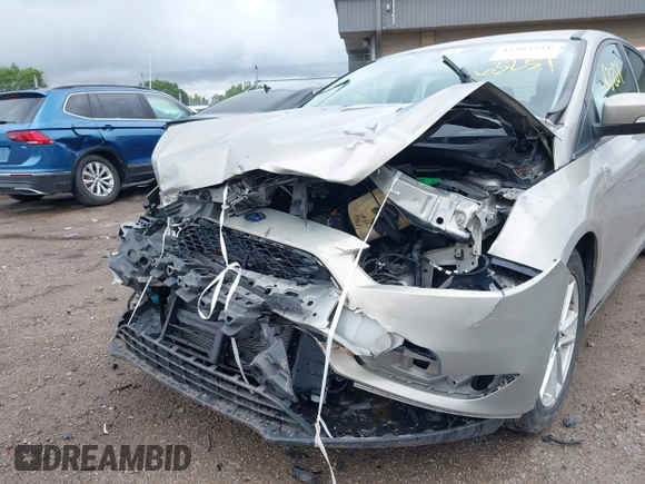 2016 Ford Focus SE z VIN 1FADP3F28GL300925, wystawiony jako IAAI lot #42563251 z przebiegiem 93 247 mil mil oraz . Historia ofert i sprzedaży dostępna na DreamBid. Obrazek 6.