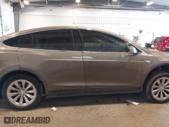 2016 Tesla Model X 70D with VIN 5YJXCBE27GF004974, listed as a IAAI auction lot 41630556 with 167,709 mi miles. Bid and sale history available at carsss.com. Image 14.
