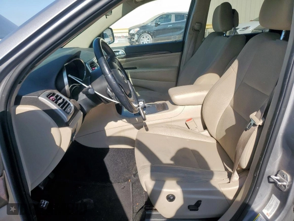 2014 Jeep Grand Cherokee Laredo with VIN 1C4RJEAG4EC182773, listed as a Copart auction lot 54085255 with 138,775 mi miles and Salvage Title. Bid and sale history available at DreamBid. Image 7.