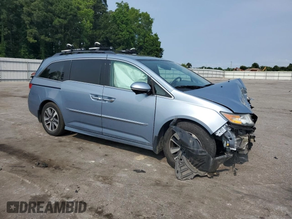 2014 Honda Odyssey Touring with VIN 5FNRL5H95EB080449, listed as a Copart auction lot 58489715 with 154,604 mi miles and Salvage title. Bid and sale history available at DreamBid. Image 4.