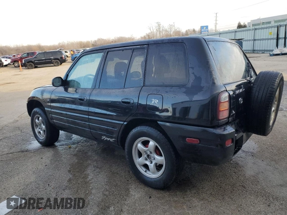 1999 Toyota RAV4 with VIN JT3GP10V9X7042801, listed as a Copart auction lot 82712874 with 256,151 mi miles and Salvage Title. Bid and sale history available at DreamBid. Image 2.