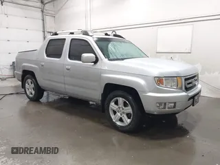 2010 Honda Ridgeline RTL z VIN 5FPYK1F50AB007711, wystawiony jako IAAI lot #41719092 z przebiegiem 134 070 mil mil oraz . Historia ofert i sprzedaży dostępna na DreamBid. Obrazek 1.