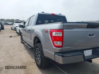 2022 Ford F-150 XL with VIN 1FTFW1E52NFA73233, listed as a IAAI auction lot 42311048 with 14,298 mi miles and . Bid and sale history available at DreamBid. Image 3.