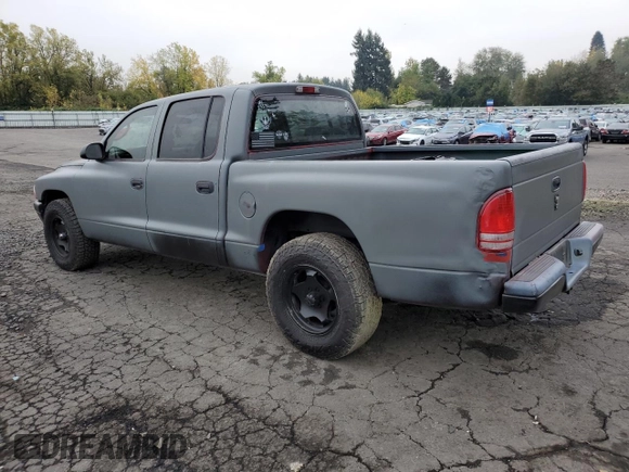 2003 Dodge Dakota Sport with VIN 1D7HL38N63S192308, listed as a Copart auction lot 77494684 with 128,512 mi miles and Salvage Title. Bid and sale history available at carsss.com. Image 2.