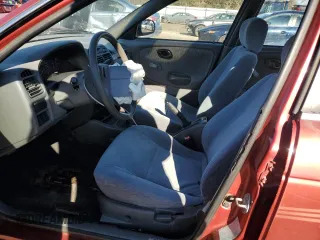 2001 Suzuki Esteem GL z VIN JS2GB41S915202412, wystawiony jako Copart lot #88372235 z przebiegiem 301 061 mil mil oraz Szkoda całkowita • Salvage title. Historia ofert i sprzedaży dostępna na DreamBid. Obrazek 7.