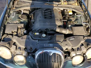 2003 Jaguar S-Type z VIN SAJEA01U73HM48330, wystawiony jako Copart lot #80128574 z przebiegiem Nie podano mil oraz Szkody całkowita. Historia ofert i sprzedaży dostępna na DreamBid. Obrazek 11.