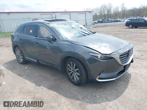2016 Mazda CX-9 Grand Touring with VIN JM3TCBDY3G0117802, listed as a IAAI auction lot 42150821 with 157,760 mi miles and . Bid and sale history available at DreamBid. Image 1.