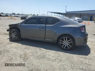 2015 Scion tC z VIN JTKJF5C76FJ010813, wystawiony jako Copart lot #58987575 z przebiegiem 108 709 mil mil oraz Szkoda całkowita • Salvage title. Historia ofert i sprzedaży dostępna na DreamBid. Obrazek 2.