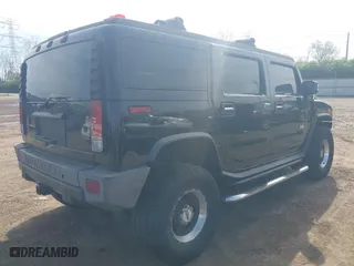 2005 Hummer H2 SUV with VIN 5GRGN23U05H128420, listed as a IAAI auction lot 41983395 with 194,925 mi miles. Bid and sale history available at carsss.com. Image 4.