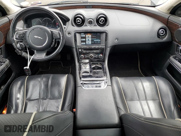 2014 Jaguar XJ Portfolio with VIN SAJWJ2GD4E8V69651, listed as a Copart auction lot 52426195 with 56,413 mi miles and Salvage title. Bid and sale history available at DreamBid. Image 8.