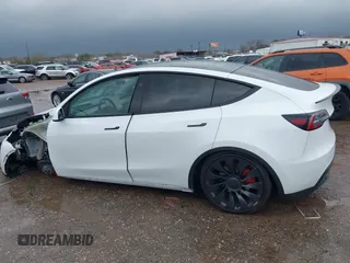 2023 Tesla Model Y Performance with VIN 7SAYGDEF7PF807312, listed as a IAAI auction lot 41711068 with 25,029 mi miles and . Bid and sale history available at DreamBid. Image 13.