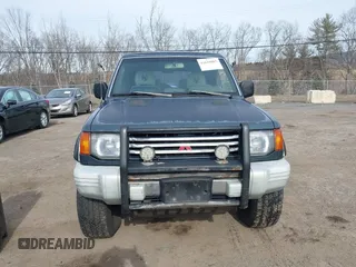 1995 Mitsubishi Montero z VIN JA4MR41H7SJ010597, wystawiony jako IAAI lot #41610885 z przebiegiem 162 406 mil mil oraz . Historia ofert i sprzedaży dostępna na DreamBid. Obrazek 12.