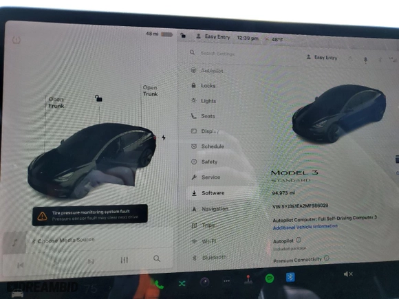 2021 Tesla Model 3 Standard Range Plus with VIN 5YJ3E1EA2MF986029, listed as a Copart auction lot 47848525 with 94,973 mi miles and Salvage Title. Bid and sale history available at carsss.com. Image 9.