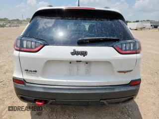 2020 Jeep Cherokee Trailhawk z VIN 1C4PJMBN0LD553823, wystawiony jako Copart lot #59796745 z przebiegiem 101 916 mil mil oraz Szkoda całkowita • Salvage title. Historia ofert i sprzedaży dostępna na DreamBid. Obrazek 6.