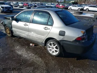2006 Mitsubishi Lancer OZ-Rally with VIN JA3AJ86E56U000207, listed as a IAAI auction lot 41401698 with 239,219 mi miles. Bid and sale history available at carsss.com. Image 3.