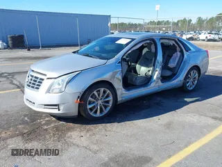 2013 Cadillac XTS Premium z VIN 2G61S5S35D9209252, wystawiony jako IAAI lot #41275066 z przebiegiem 132 311 mil mil oraz . Historia ofert i sprzedaży dostępna na DreamBid. Obrazek 2.