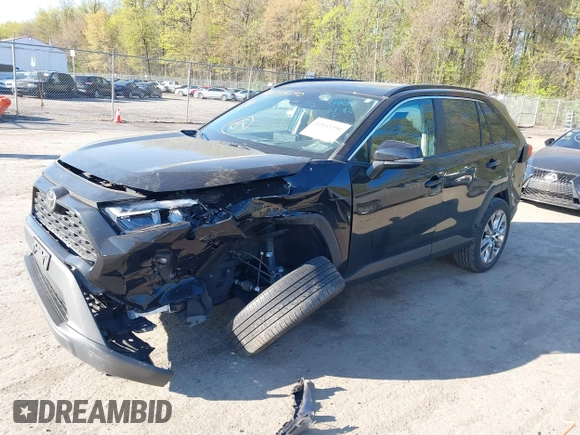 2022 Toyota RAV4 XLE Premium with VIN 2T3A1RFV6NC283890, listed as a IAAI auction lot 42045390 with 69,180 mi miles and . Bid and sale history available at DreamBid. Image 2.