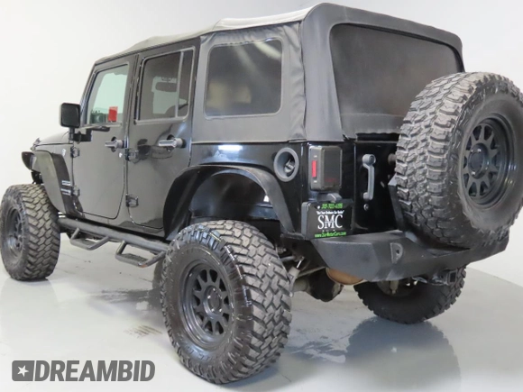 2018 Jeep Wrangler Unlimited Sport S with VIN 1C4HJWDG8JL927497, listed as a Copart auction lot 62701315 with 91,992 mi miles and Salvage title. Bid and sale history available at DreamBid. Image 4.