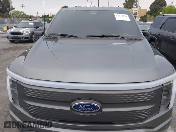 2023 Ford F-150 Lightning Pro with VIN 1FTVW1EL8PWG48559, listed as a IAAI auction lot 42033123 with 8,845 mi miles and . Bid and sale history available at DreamBid. Image 10.