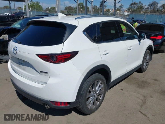 2020 Mazda CX-5 Grand Touring with VIN JM3KFADM0L1838495, listed as a IAAI auction lot 41991566 with 32,021 mi miles. Bid and sale history available at carsss.com. Image 4.