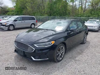 2020 Ford Fusion SEL z VIN 3FA6P0CD5LR131097, wystawiony jako IAAI lot #42218517 z przebiegiem 94 394 mil mil oraz . Historia ofert i sprzedaży dostępna na DreamBid. Obrazek 2.