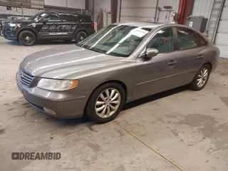2007 Hyundai Azera SE with VIN KMHFC46F07A243229, listed as a IAAI auction lot 41261394 with 249,523 mi miles and . Bid and sale history available at DreamBid. Image 2.