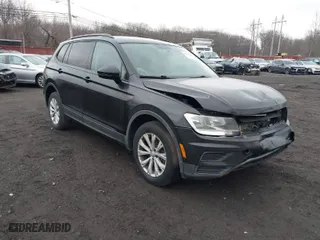 2018 Volkswagen Tiguan S with VIN 3VV1B7AX9JM091210, listed as a IAAI auction lot 41683380 with 63,627 mi miles. Bid and sale history available at carsss.com. Image 1.