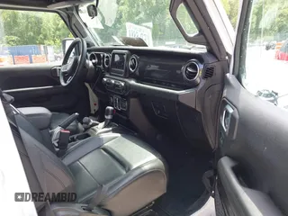 2021 Jeep Wrangler Unlimited Sahara z VIN 1C4HJXEN6MW764662, wystawiony jako IAAI lot #42494617 z przebiegiem 81 954 mil mil oraz . Historia ofert i sprzedaży dostępna na DreamBid. Obrazek 5.