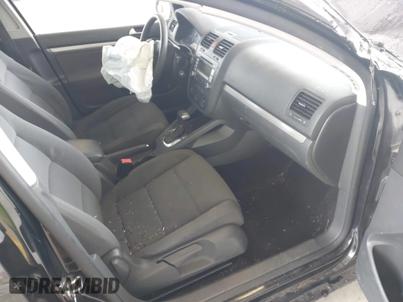 2009 Volkswagen Rabbit S z VIN WVWDB71K59W138874, wystawiony jako IAAI lot #42421953 z przebiegiem 134 616 mil mil oraz . Historia ofert i sprzedaży dostępna na DreamBid. Obrazek 5.