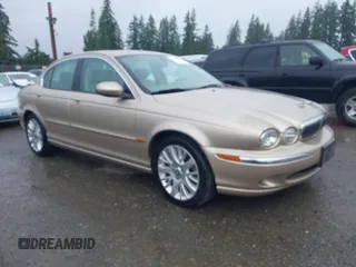 2003 Jaguar X-Type 2.5L Manual z VIN SAJEA51D53XC94089, wystawiony jako IAAI lot #42370566 z przebiegiem 81 687 mil mil oraz . Historia ofert i sprzedaży dostępna na DreamBid. Obrazek 1.