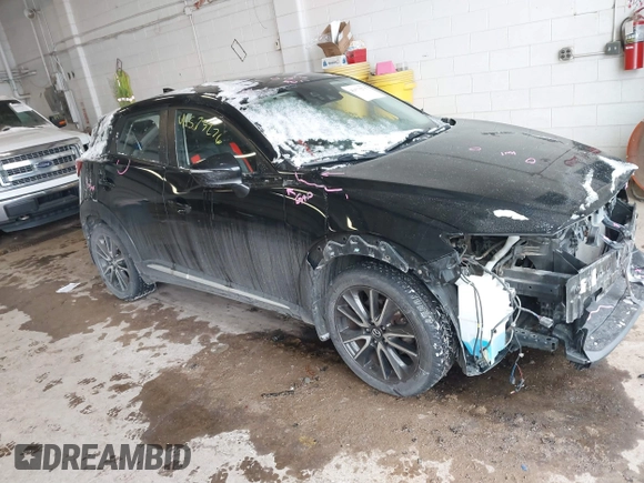 2016 Mazda CX-3 Grand Touring with VIN JM1DKFD71G0132801, listed as a IAAI auction lot 41573276 with 90,000 mi miles. Bid and sale history available at carsss.com. Image 1.
