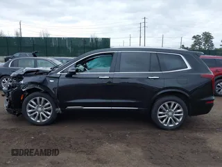 2021 Cadillac XT6 Premium Luxury with VIN 1GYKPCRSXMZ222454, listed as a IAAI auction lot 41648439 with 113,547 mi miles and . Bid and sale history available at carsss.com. Image 14.