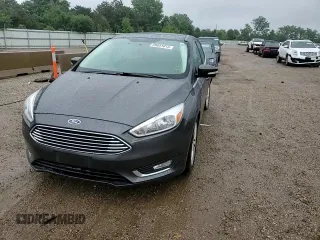 2018 Ford Focus Titanium z VIN 1FADP3N21JL295883, wystawiony jako Copart lot #59051015 z przebiegiem 43 284 mil mil oraz Szkoda całkowita • Salvage title. Historia ofert i sprzedaży dostępna na DreamBid. Obrazek 13.