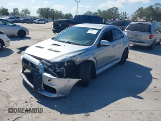 2013 Mitsubishi Lancer Evolution MR with VIN JA32W5FV6DU013470, listed as a IAAI auction lot 41544077 with 124,262 mi miles. Bid and sale history available at carsss.com. Image 2.