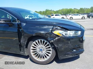 2016 Ford Fusion Titanium with VIN 3FA6P0K9XGR158234, listed as a IAAI auction lot 42043716 with 161,164 mi miles. Bid and sale history available at carsss.com. Image 6.