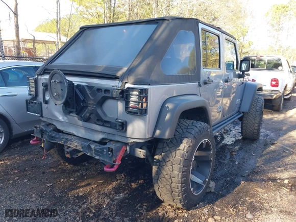 2015 Jeep Wrangler Unlimited Rubicon Hard Rock with VIN 1C4HJWFG1FL777222, listed as a IAAI auction lot 41843893 with 74,718 mi miles. Bid and sale history available at carsss.com. Image 4.