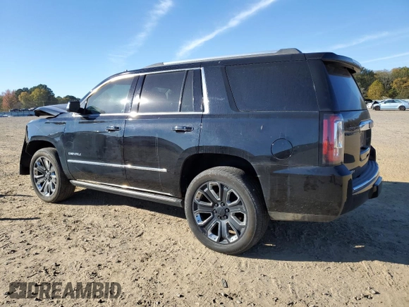 2018 GMC Yukon Denali with VIN 1GKS2CKJ3JR404177, listed as a Copart auction lot 82577354 with 129,744 mi miles and Salvage Title. Bid and sale history available at carsss.com. Image 2.