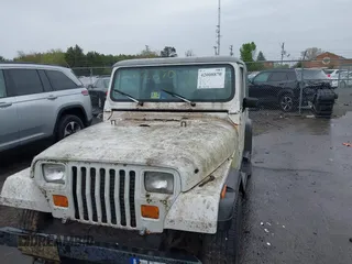 1990 Jeep Wrangler with VIN 2J4FY29T6LJ523487, listed as a IAAI auction lot 42008870 with 88,619 mi miles and . Bid and sale history available at DreamBid. Image 6.