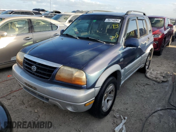 2003 Suzuki Grand Vitara z VIN JS3TE62V534100751, wystawiony jako Copart lot #76714894 z przebiegiem Nie podano mil oraz Nie do naprawy • Non repairable. Historia ofert i sprzedaży dostępna na DreamBid. Obrazek 1.